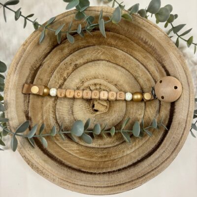 Attache tétine doré